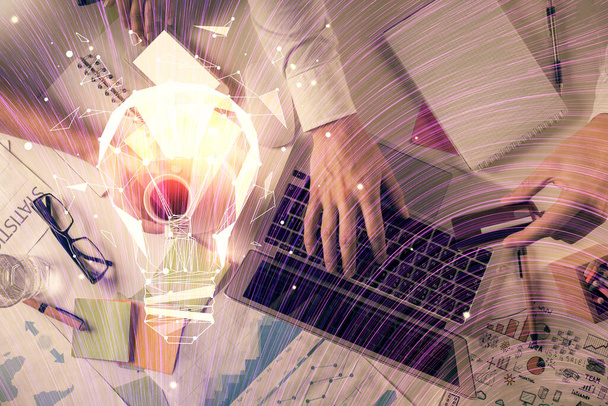 Double exposure of man and woman working together and bulb drawing. Computer background. Top View. Idea concept. - Photo, image