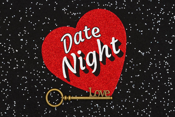 Date Night type message with skeleton key with a red heart on black sparkle felt  - Photo, Image