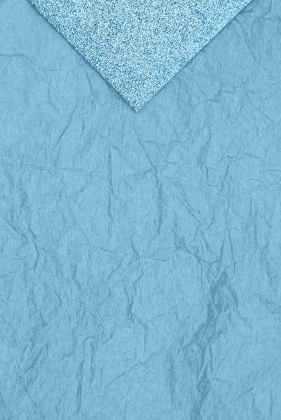 Blue sparkle top with tissue paper background with copy space for holiday message - Photo, Image