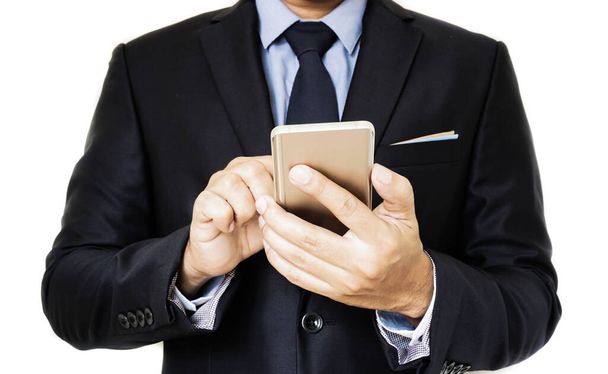 the businessman using a smartphone. - Zdjęcie, obraz