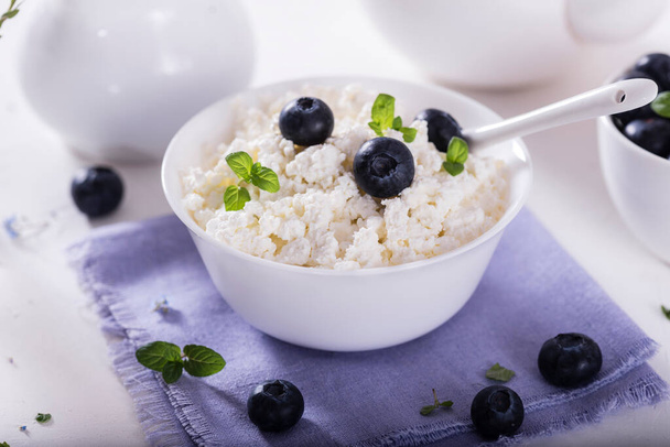 healthy breakfast cottage cheese in white bowl with fresh summer  berries - Fotó, kép