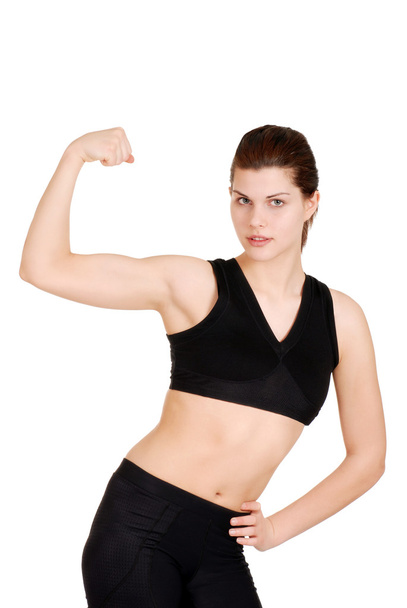 Young woman showing off muscles - 写真・画像