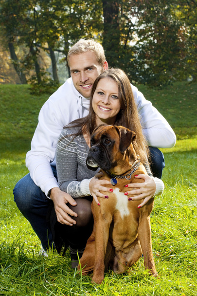 Happy Young Couple with Dog - Φωτογραφία, εικόνα