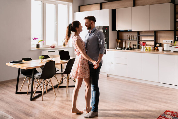 Man and woman dancing in a modern interior - Photo, Image