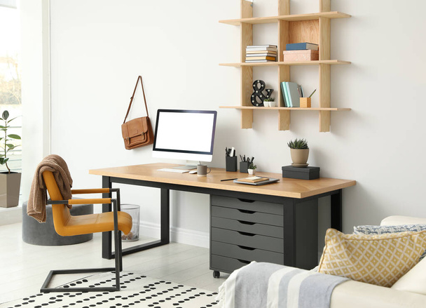 Stylish room interior with modern comfortable workplace - Fotografie, Obrázek