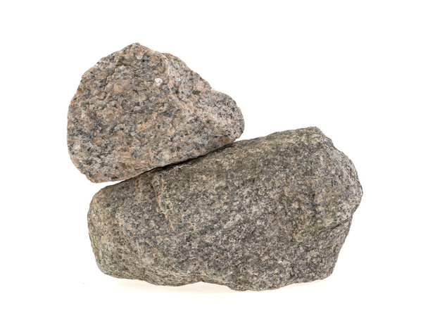 Pedra de granito natural sobre um fundo branco, isolado
 - Foto, Imagem