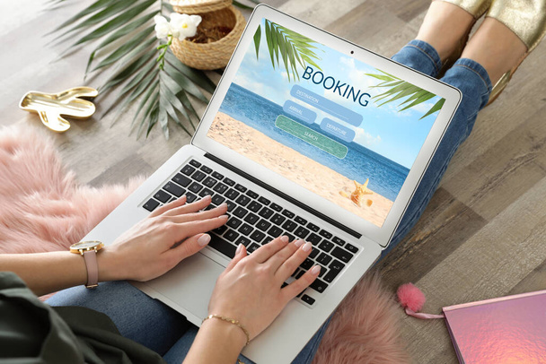 Woman using laptop to plan trip, closeup. Travel agency website - Zdjęcie, obraz