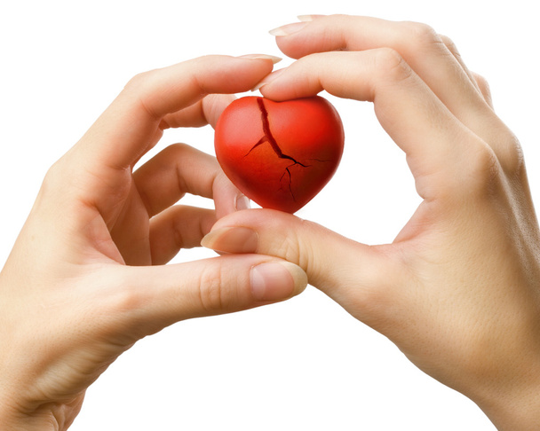 Зламане червоне серце в руках
 - Фото, зображення