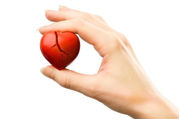 Broken red heart in hand - Photo, Image