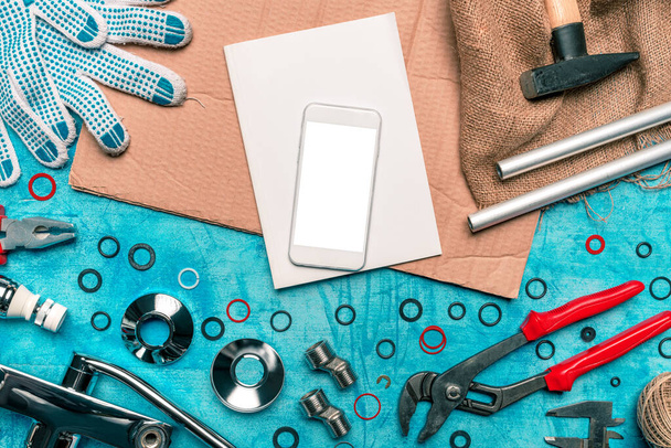 Plumbing DIY tutorial app smartphone mock up, mobile phone with blank screen, top view - Φωτογραφία, εικόνα
