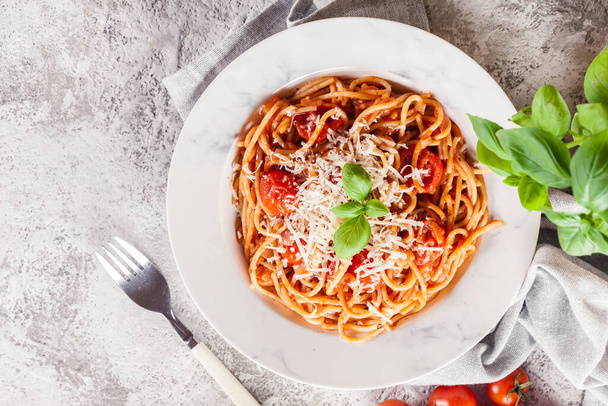 Spaghetti Napoli with parmesan cheese. Traditional italian dish - Valokuva, kuva
