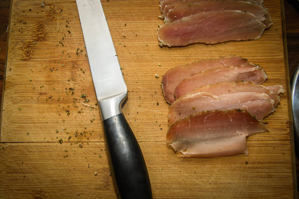 Slice of ham and knife - Photo, Image