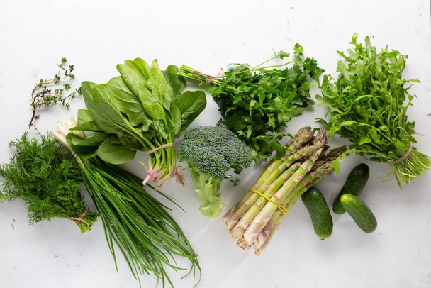 Green organic vegetables and herbs top view - Fotografie, Obrázek