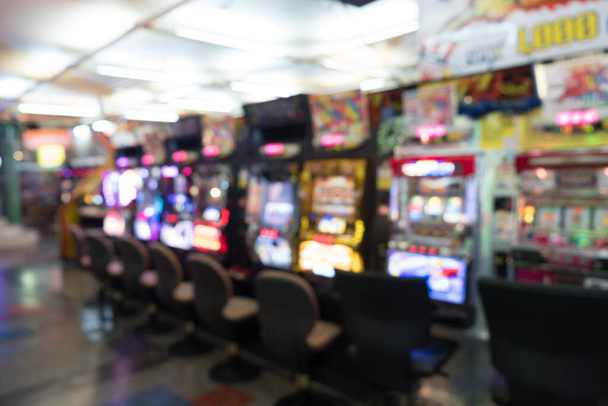 Blurry photograph of game arcade center - Photo, Image