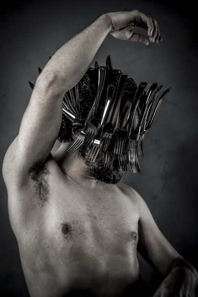 Man in helmet made from forks - Fotó, kép