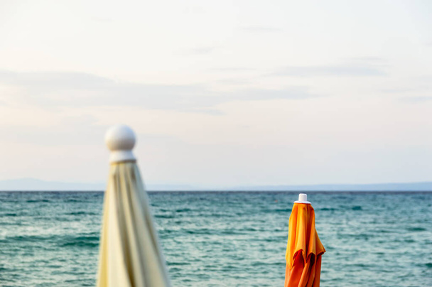 Parasol and sunbeds on the beach - Photo, Image