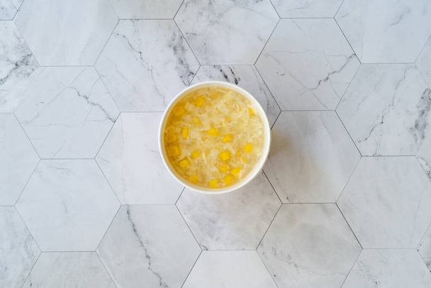 Take Away Healthy Food Corn Soup with Chicken Slices in Plastic Cup. Take Out. Ready to Eat. - Fotó, kép