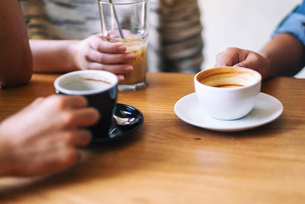 Closeup image of people enjoyed drinking coffee together in cafe - Photo, Image