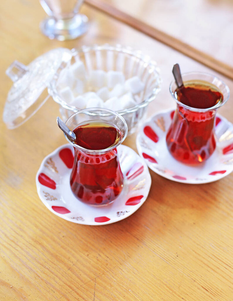 traditional turkish tea with sugar cubes on wooden table - Zdjęcie, obraz