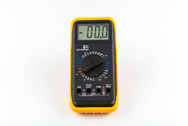 Multimeter for a measurement of a voltage, current and resistance with cables. Digital multimeter to check the resistance on a white background. - Photo, Image