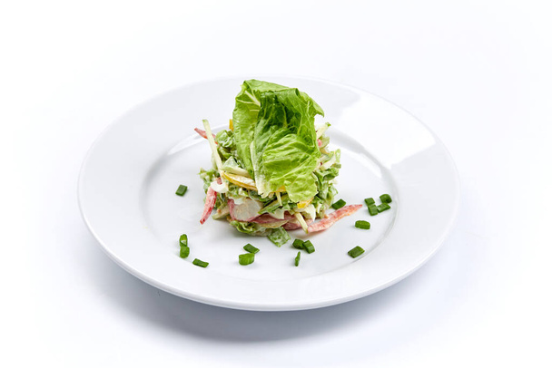 fresh vegetarian salad on white plate, close view  - Fotó, kép