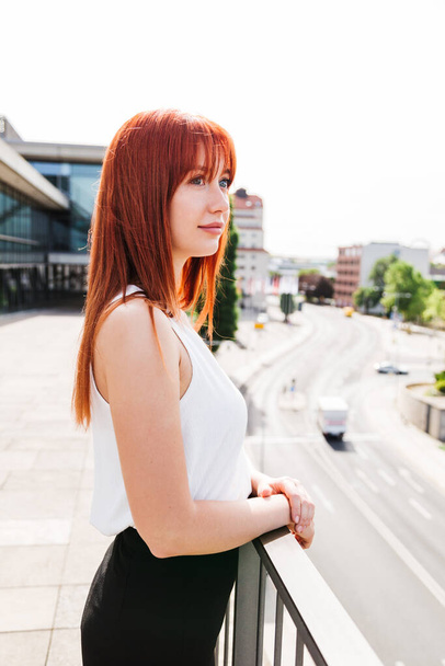 Young redhead business woman in formal outside - Foto, Imagen