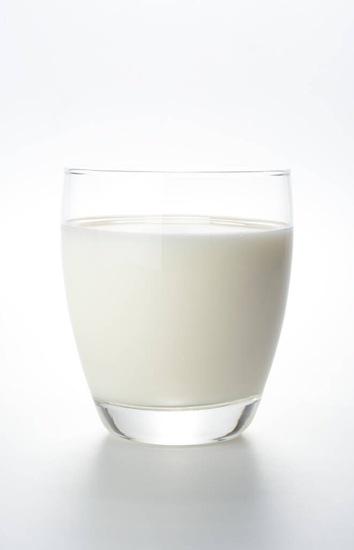 Glass of milk on white background - Фото, изображение