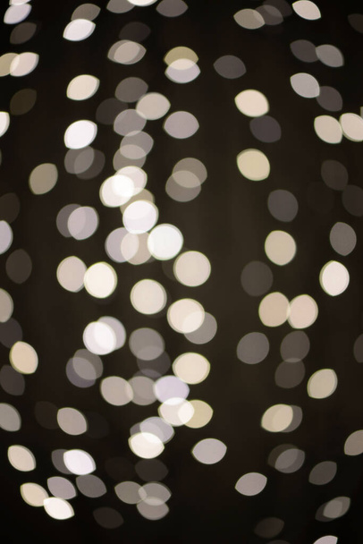 Defocused lights on the black background, optic effect - Fotografie, Obrázek