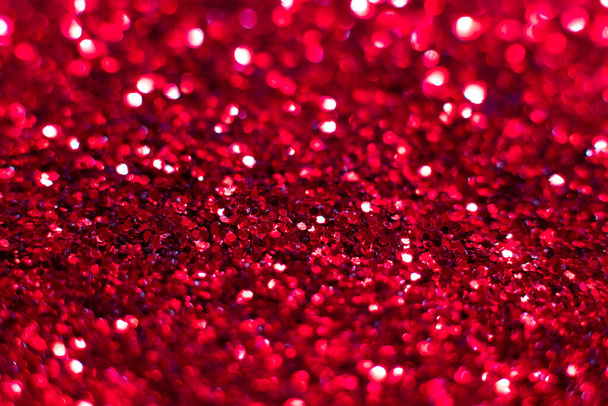 Red glitter texture. Festive sparkling sequins background closeup. Brilliant shiny walpaper for the day of St. Valentine, New Year and Christmas Holidays. - Foto, Imagem