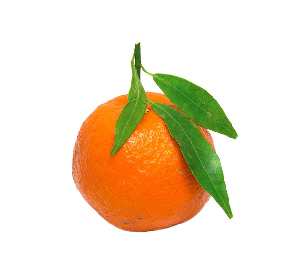 One ripe irregular orange mandarin with spots and green leaves isolated on a white background - Photo, Image