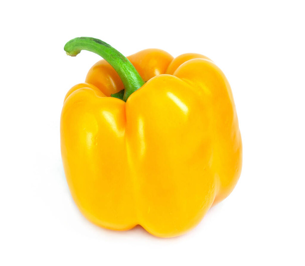 One bright yellow raw washed with tail sweet bulgarian pepper isolated on white background - Foto, afbeelding