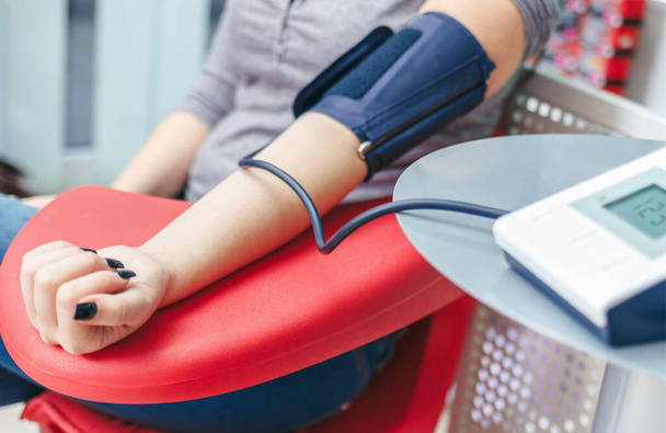 Blood pressure checking with digital monitor  - Фото, зображення