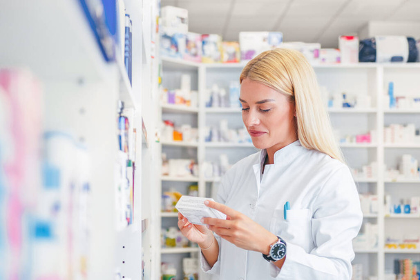 Working in Pharmacy store - Photo, Image