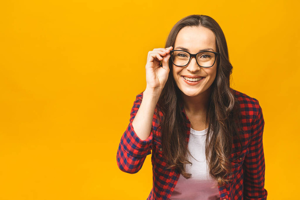 People style stylish health care healthcare person doubt concept. Close up portrait of concentrated beautiful lady with bad vision touching glasses trying to read text isolated on yellow background. - Photo, Image