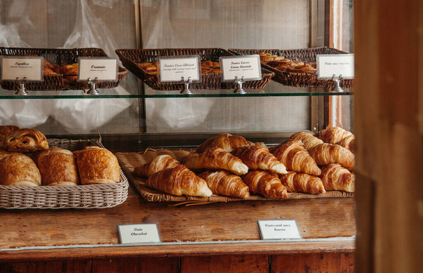 Assorted french pastry bakery desserts in small local old bakery shop - Photo, Image