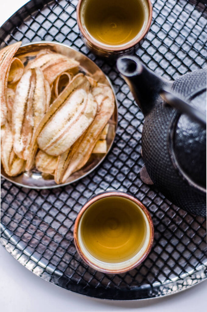 Chinese Tea set with crispy fried banana top angle shot - Photo, Image