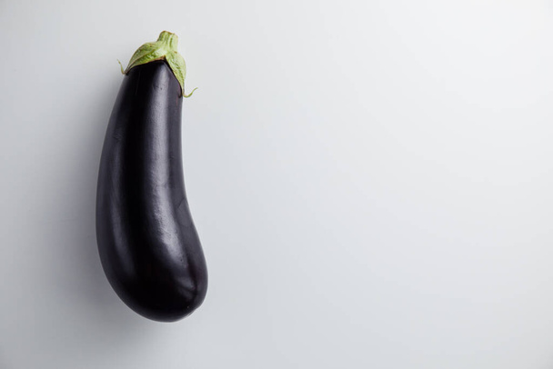 Eggplant on a white background. Minimum concept - Φωτογραφία, εικόνα