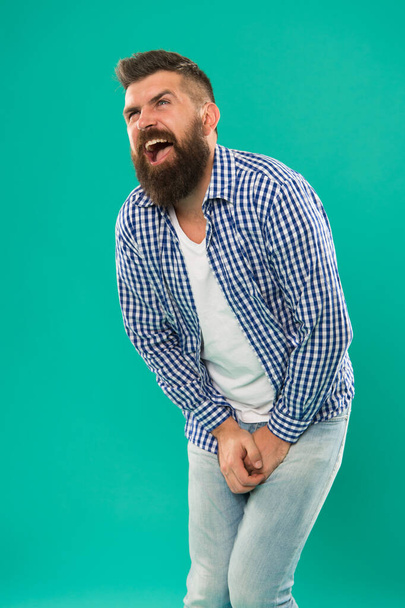 Kicked in the balls. Testicular Blow. Guy got hit in the crotch. Guy folds himself while trying to deal with the pain. Sharp pain that incapacitates your whole body. Bearded man suffering. Attacked - 写真・画像
