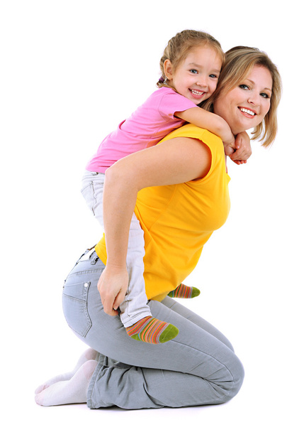 Beautiful mom with little daughter isolated on white - Fotó, kép