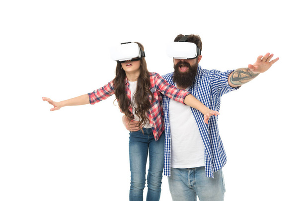 sense of freedom. feel free in glasses of virtual reality. future technology concept. daughter and dad in wireless vr headset. modern education at home. play virtual game together. family having fun - Foto, Imagem