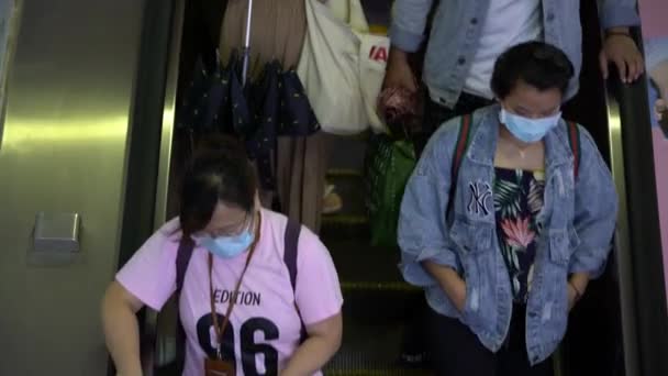 Taipei, Taiwan-07 June, 2020: 4K, Crowd people wearing surgical mask in subway entrance escalator. Coronavirus pneumonia has been spreading into many cities. 2019-nCoV - Footage, Video