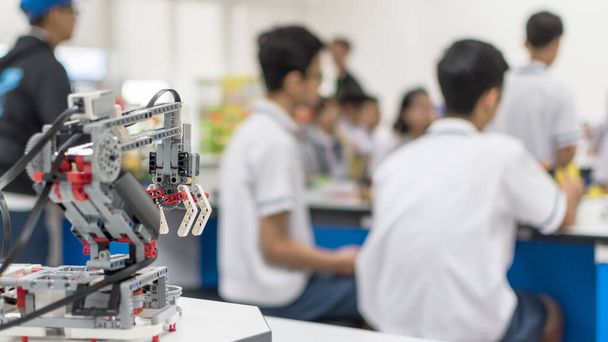 Robotic lab class with school students blur background learning in group having study workshop in science technology engineering classroom for STEM education concept - Photo, Image
