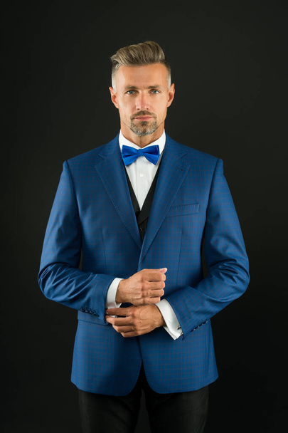event host wear bow tie. sexy adult man in stylish tuxedo. male fashion and beauty. handsome man has graying unshaven face. skilled sommelier. bride groom on wedding day - Fotografie, Obrázek