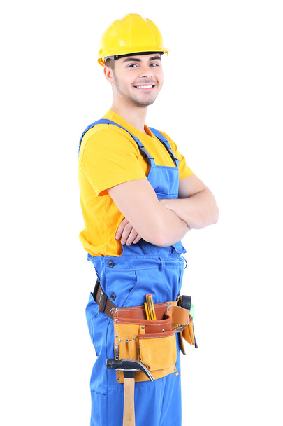 Male builder in yellow helmet isolated on white - Foto, Bild