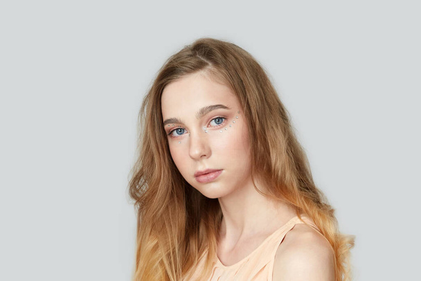 Portrait of a blonde girl with blue eyes. Long hair. - Fotoğraf, Görsel