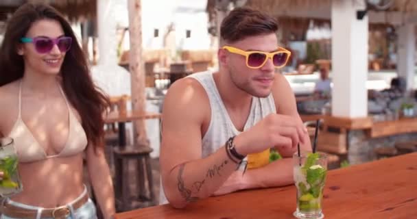 Young hipster friends having fun meeting at summer beach bar - Footage, Video