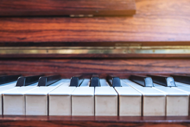 Closeup image of a vintage wooden grand piano - Фото, изображение