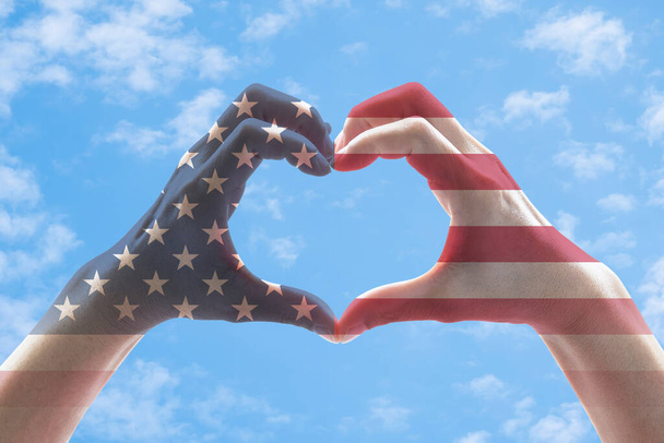 United States of America flag pattern people hands in heart shape - 写真・画像