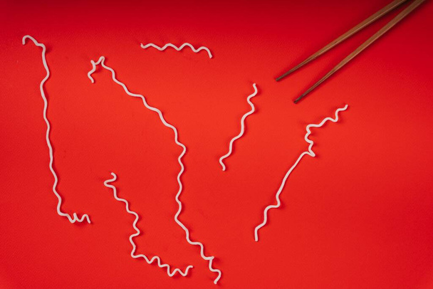Texture of instant noodle over red background. Isolate in red. Line texture. - Photo, Image