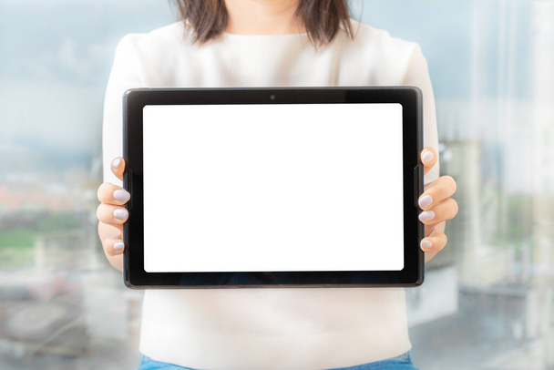 Women hold and digital tablet device, female hands show the tablet , front view, mockup - Fotografie, Obrázek
